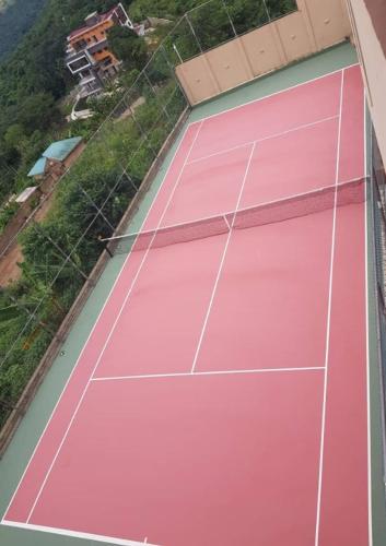 an overhead view of a tennis court at Brown Hills Residences in Aburi