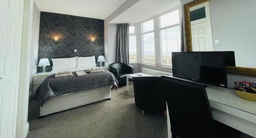 Postel nebo postele na pokoji v ubytování Windsor Park Hotel