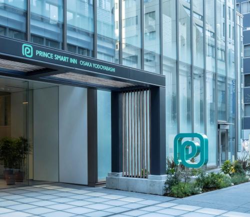 a building with a sign that reads prince swift im central vancouver at Prince Smart Inn Osaka Yodoyabashi in Osaka