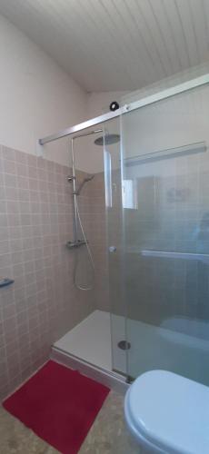 a bathroom with a shower with a glass door at Villa Troc Pinell in Banyuls-sur-Mer