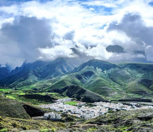a view of a mountain valley with houses and mountains at Cool Canaria in Agaete