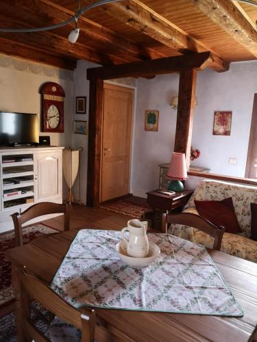 a living room with a table with a tea pot on it at East Wind in Medea
