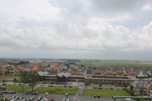 a city with cars parked in a parking lot at Hotel De Zeebries Budget in Middelkerke