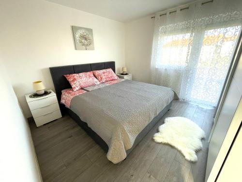 Postel nebo postele na pokoji v ubytování Apartments Elvira
