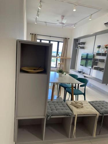 a kitchen and dining room with a table and chairs at Traders garden c180 in Cheras