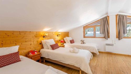 Ένα ή περισσότερα κρεβάτια σε δωμάτιο στο Madame Vacances Résidence Les Jardins de la Vanoise