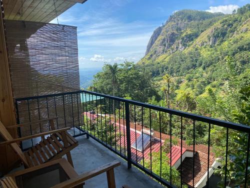 a balcony with a view of the mountains at Country Homes in Ella