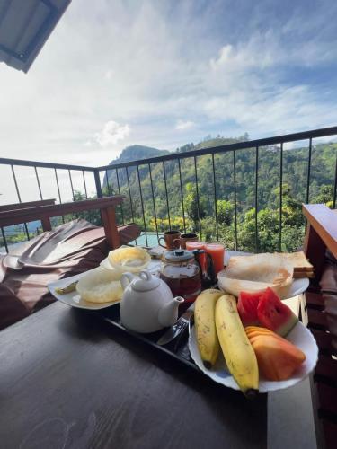 a tray of breakfast foods on a table with a view at Country Homes in Ella