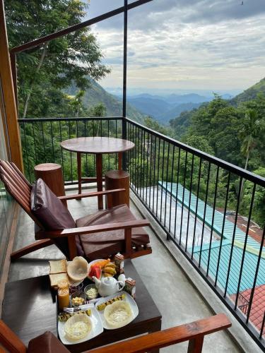 a tray of food on a table on a balcony at Country Homes in Ella