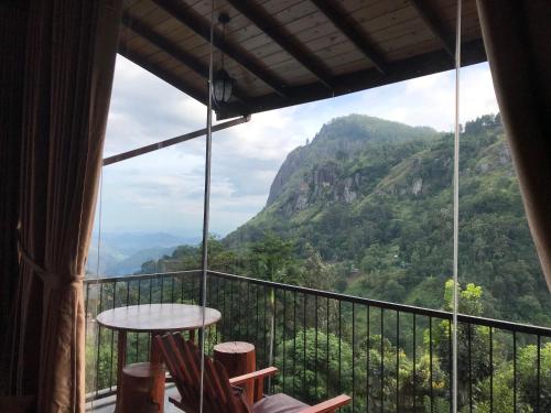 a room with a view of a mountain at Country Homes in Ella