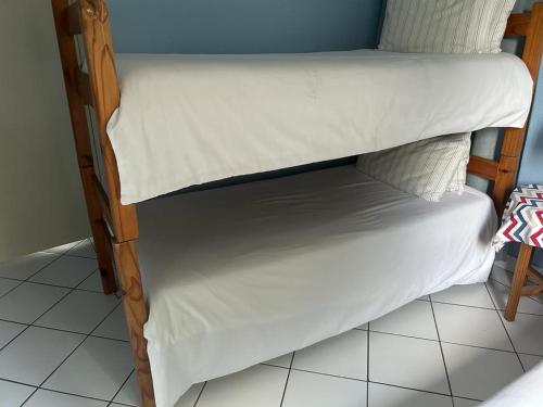 a pair of bunk beds in a room at 205 Laguna lacrete in Uvongo Beach