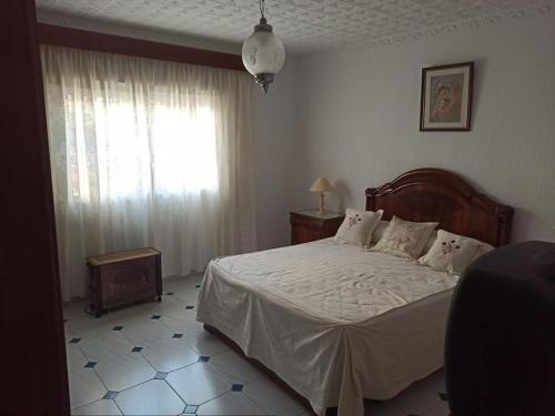 Ένα ή περισσότερα κρεβάτια σε δωμάτιο στο La casa de Lola