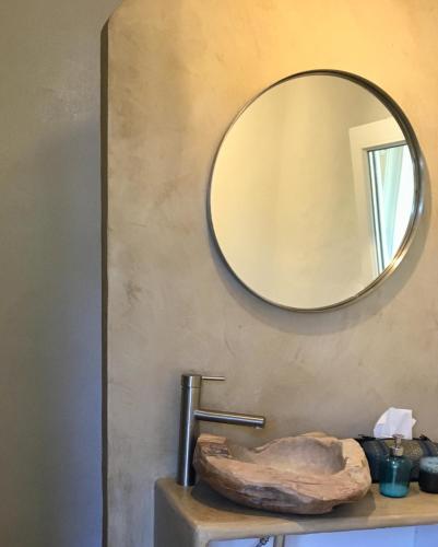a mirror on a wall next to a sink at La Careza De Mijas - Adults Only in Mijas