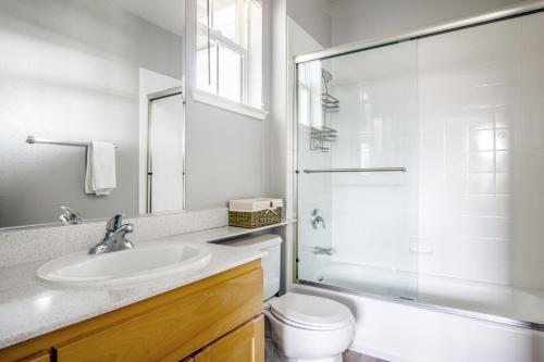 a bathroom with a sink and a toilet and a shower at Santa Clara 3BR w Gym Pool WD nr highways SFO-463 in Santa Clara