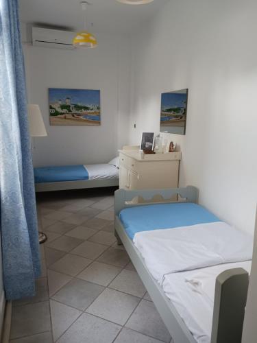 Postel nebo postele na pokoji v ubytování Zenith Luxury Apartments Near Kaiki Beach