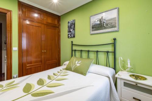 Кровать или кровати в номере Coqueto piso en Ampuero