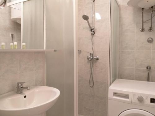 a bathroom with a shower and a sink and a toilet at Apartment Katerina in Medulin