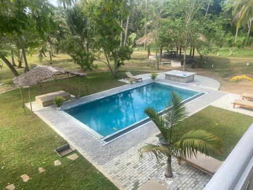 an overhead view of a swimming pool in a yard at CJ's House at Mawella in Mawella