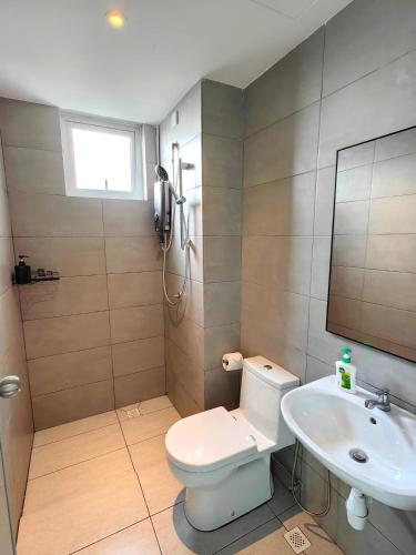 a bathroom with a toilet and a sink at METROPOL SERVICED APARTMENT at Bukit Mertajam, Pulau Pinang in Bukit Mertajam