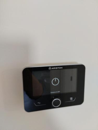 a smart phone hanging on a wall at Gioja suite in Quartu SantʼElena