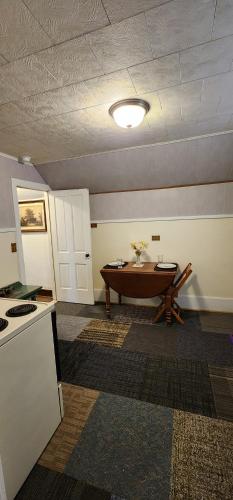 a room with a tub in the middle of a room at Super Spacious 1 bedroom w/n walking dist' to town in Manistee