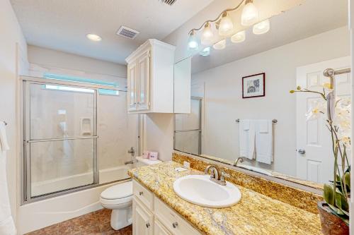 a bathroom with a sink and a toilet at Sea Breeze in Galveston