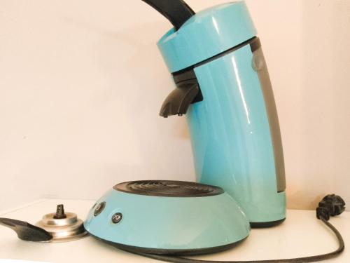 a blue blender sitting on top of a counter at Le Relais Bastide de Cordes sur Ciel in Cordes-sur-Ciel