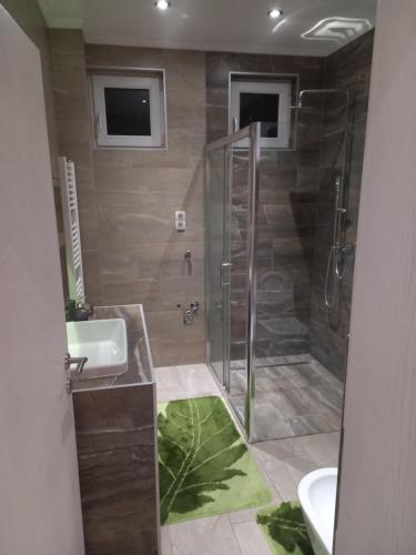 a bathroom with a shower and a sink at Lux Old Bridge in Mostar