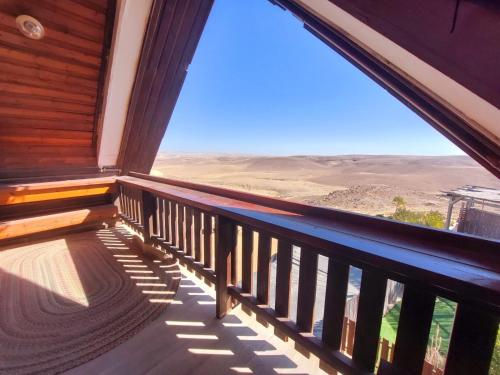 a balcony with a view of the desert at חלון למדבר in Arad