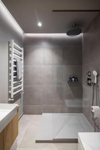 a bathroom with a shower and a sink at Apartment in Cēsis in Cēsis