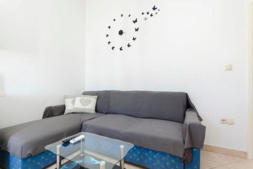 a living room with a couch and a table at Apartment Marija in Vodice