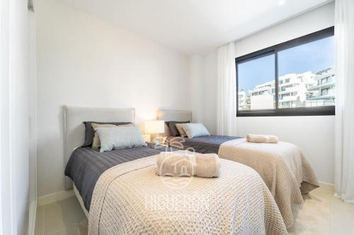 Posteľ alebo postele v izbe v ubytovaní HigueronRentals Casa Flora
