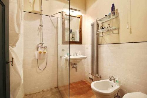 a bathroom with a shower and a toilet and a sink at Villa Trenta Prestigious Villa Enchanting Garden in Lucca