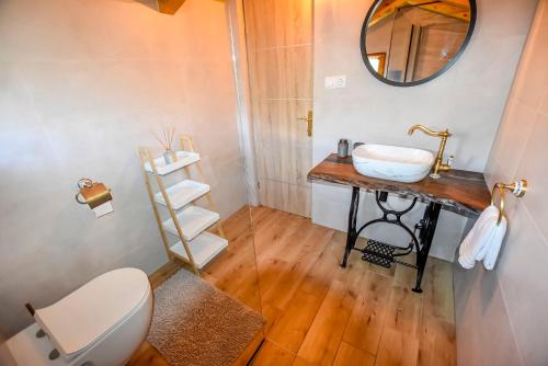 a bathroom with a sink and a mirror at House Kastel in Tkon