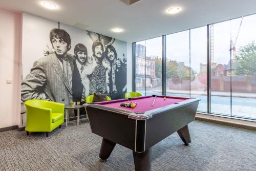 a room with a pool table and a mural at For Students Only Glassworks in Liverpool in Liverpool