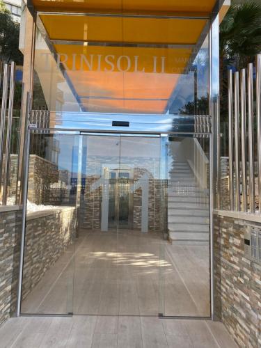 an entrance to a building with a glass door at LuxBenidorm in Benidorm