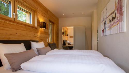 a bedroom with a large white bed in it at Das Logierhaus in Bad Alexandersbad