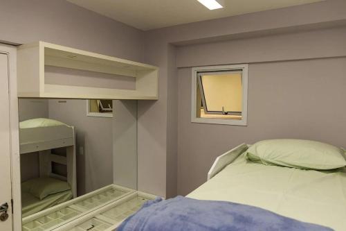 Ένα ή περισσότερα κρεβάτια σε δωμάτιο στο Residencial Helbor Resort Aracaty