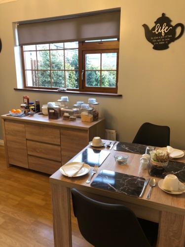 a kitchen with a table and a counter at Manorlodge in Tralee