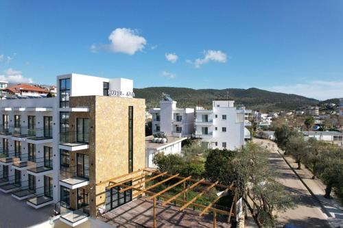 an aerial view of a building with mountains in the background at Hotel ABA in Ksamil