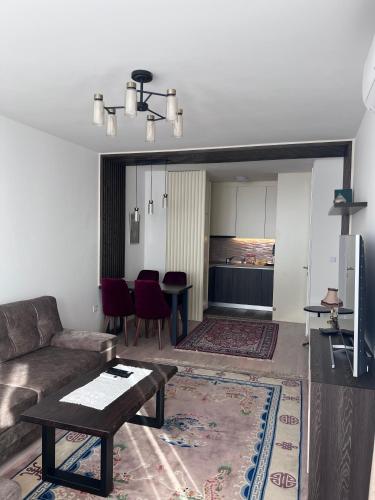 a living room with a couch and a table at SkyView Apartment in Sarajevo