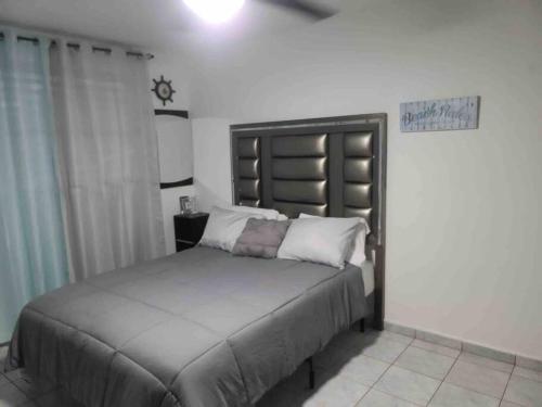 a bedroom with a large bed in a room at Caracoles Breeze Apartments in Islote