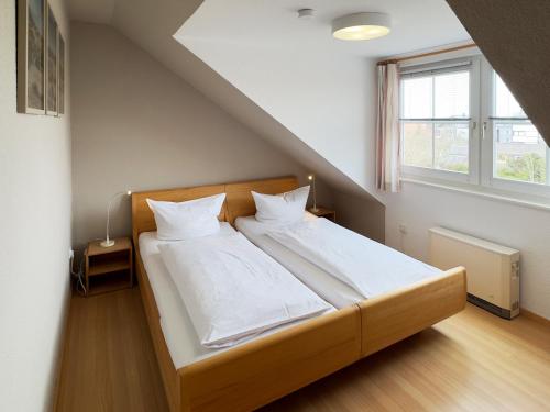 Ένα ή περισσότερα κρεβάτια σε δωμάτιο στο Ferienwohnung *Gaubenkieker*