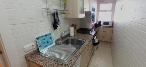 a small kitchen with a sink and a counter at Arena in Hospitalet de l'Infant