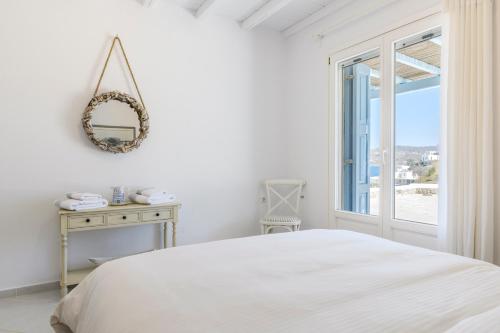 Ένα ή περισσότερα κρεβάτια σε δωμάτιο στο Villa Deliana by Ethos Hospitality