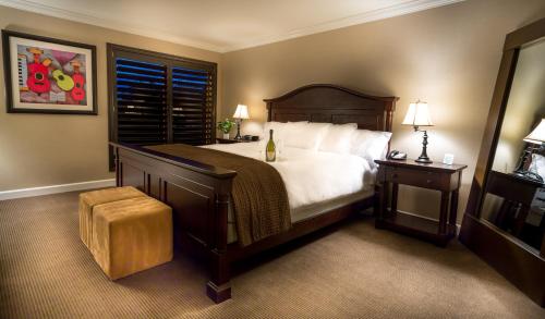 a bedroom with a large bed and a window at Cupertino Hotel in Cupertino