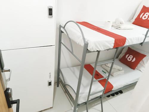 Una cama o camas en una habitación de 8Hostel