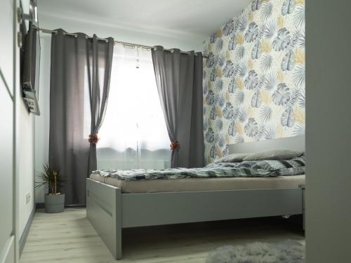 Postel nebo postele na pokoji v ubytování Apartament Uniejów