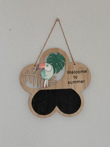 a welcome to summer sign with a moustache at Cozy Room near Metro & Airport in Lisbon