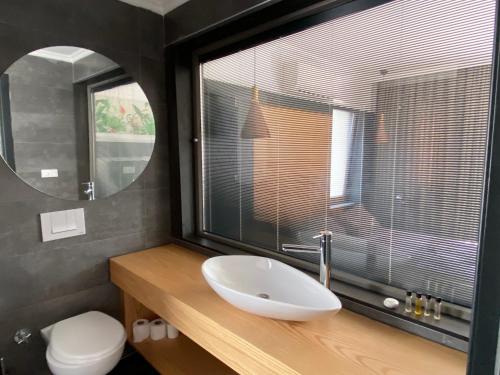 a bathroom with a sink and a large window at On Oda Oludeniz in Oludeniz